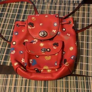 Gently used Coach backpack purse, orange/floral